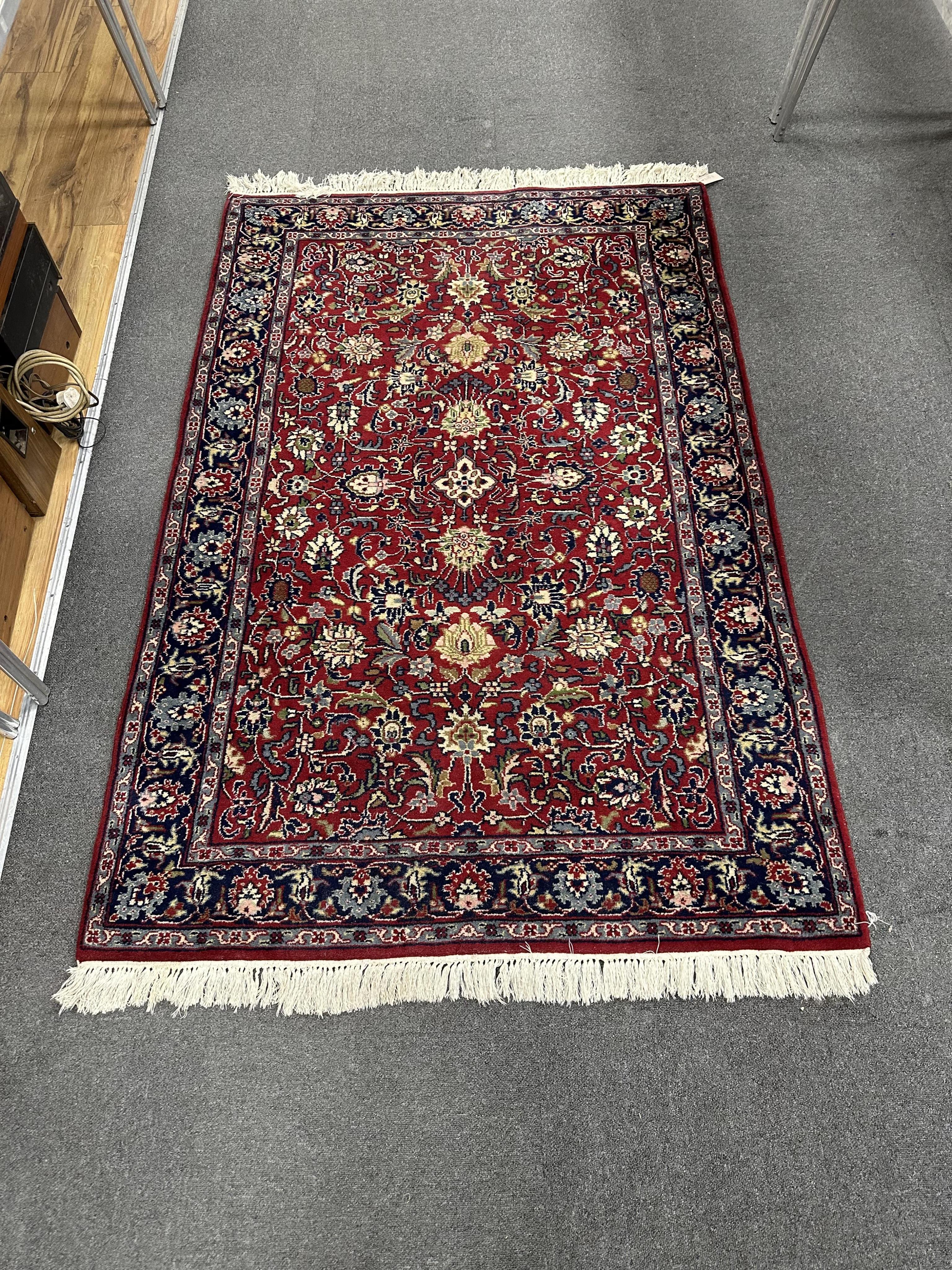 A North West Persian red ground rug, 190cm x 124cm. Condition - good.